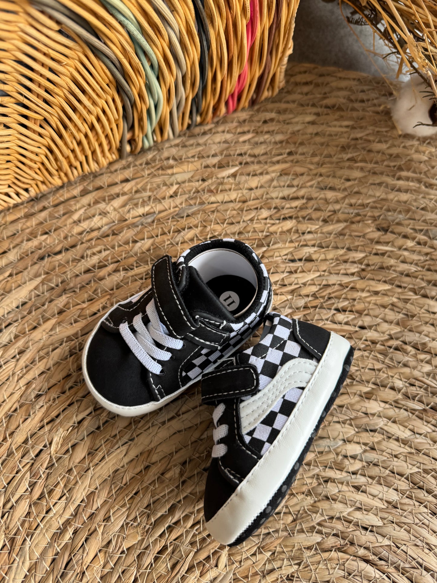 Black and white Vans with square