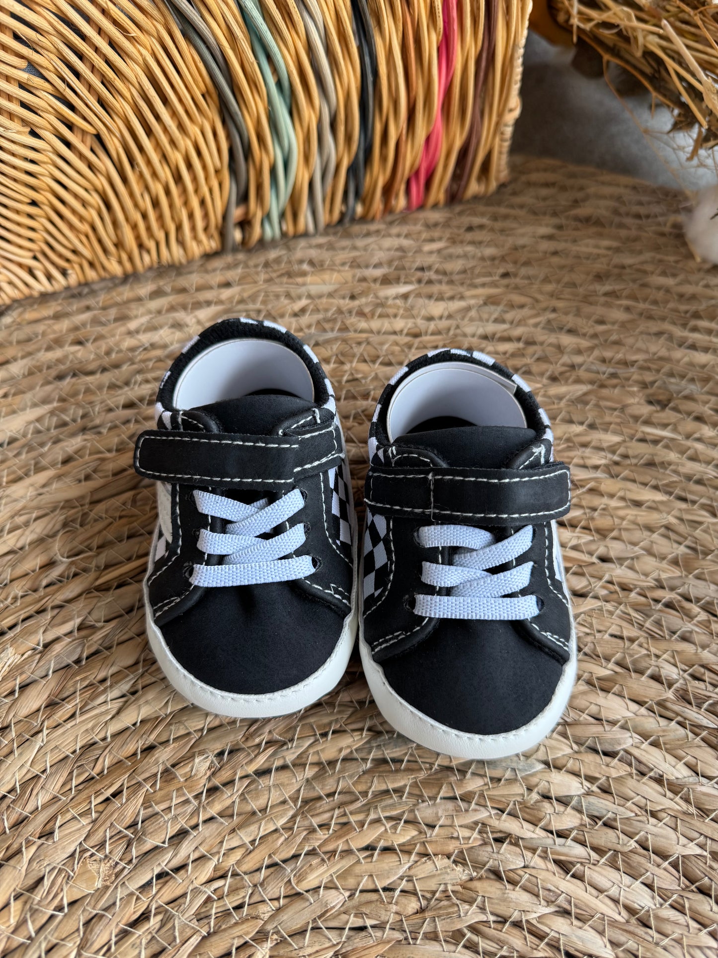 Black and white Vans with square